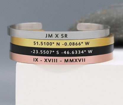 Modern unisex stainless steel cuff bracelet with brushed texture and space for custom lettering.