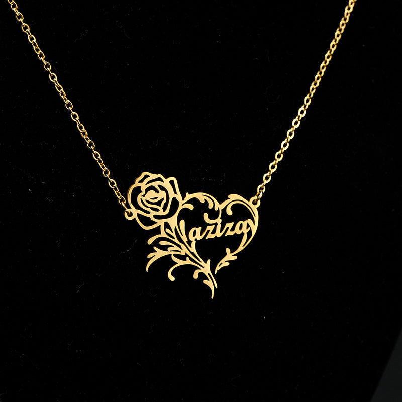 Gold necklace with a heart and rose design featuring a personalized name.
