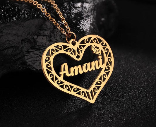 Gold heart-shaped pendant with engraved name