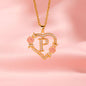 "Close-up of a gold necklace with minimalist hollow heart-flower pendant and personalized lettering."
